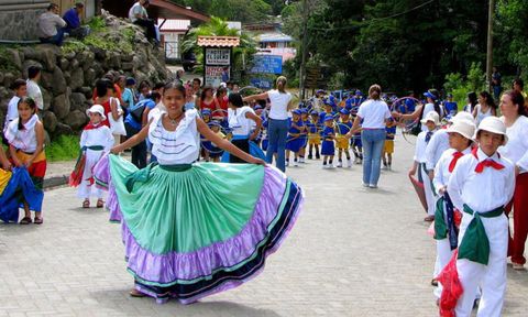 Local children dance in traditional dress